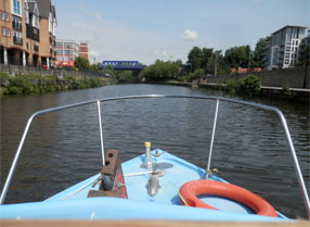Hire Cruiser heading down stream on the River Medway from Maidstone